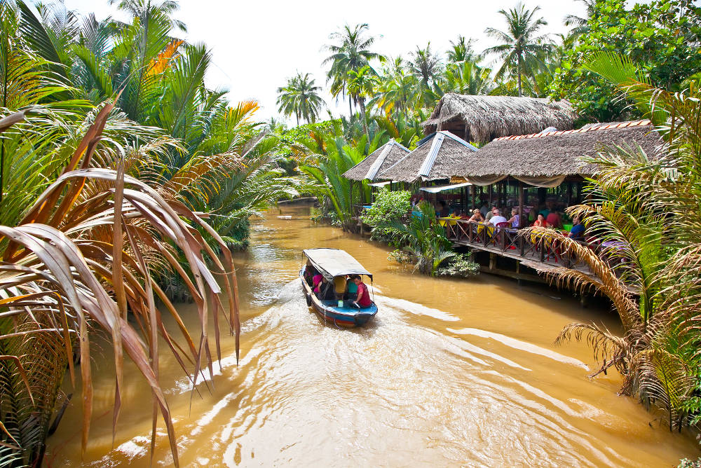 BEN TRE, VIETNAM-NOV 18, 2013: A famous tourist destination is  Ben Tre village on Nov 18, 2013. in Mekong delta , Vietnam. Mekong Delta is home of people who live along the many channels.